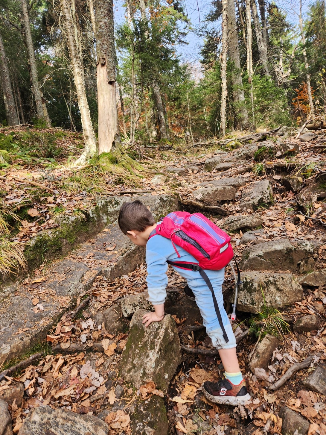 kid clambering rocks