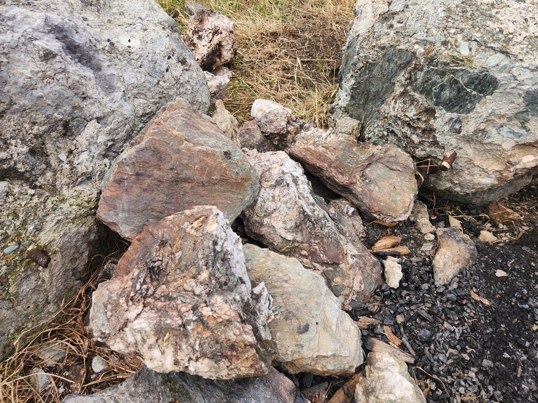 Some rusty bolts were sticking out of these boulders. I remember seeing photos of some kind of memorial. I guess this used to be it.